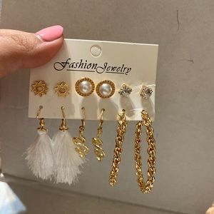 6 pairs of earrings. 3 studs and 3 dangling earrings